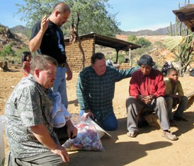 Praying with village chief.
